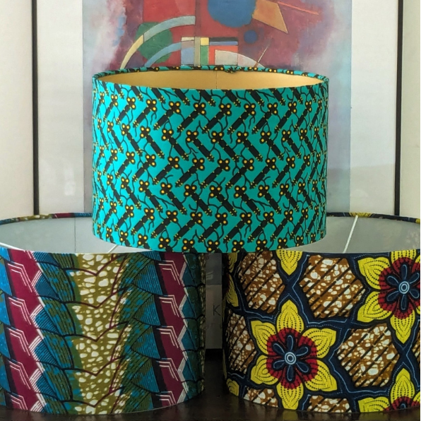A trio of colourful & bold African wax print patterned handmade drum lampshades. 
