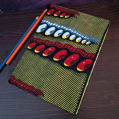 African Patterned A5 Lined Notebook FIOFIO: Mustard with blue red white pigeon pea pods